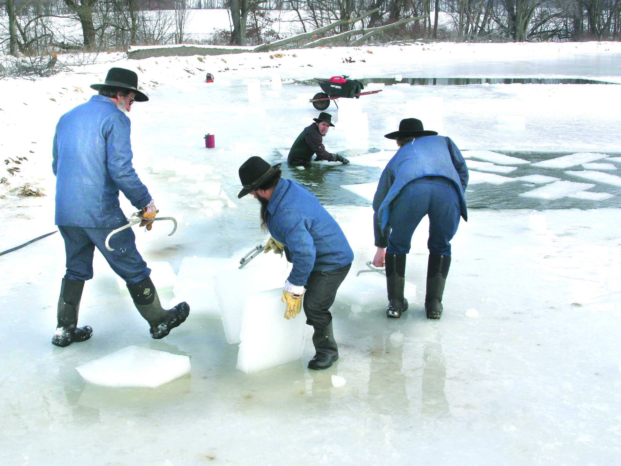 Men pulling ice