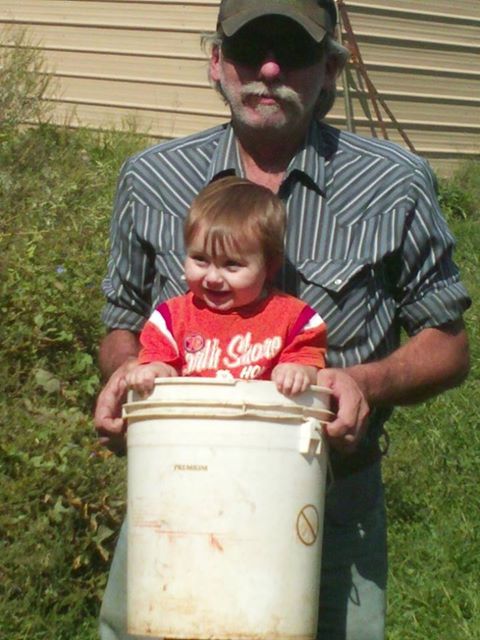 Grandson Camden goes everwhere with his grandfather on the Fitzringer farm.