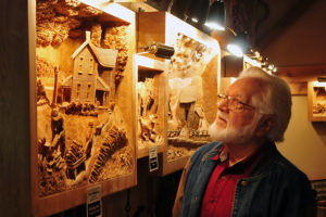 Jay Lehman Viewing Weaver's Carvings