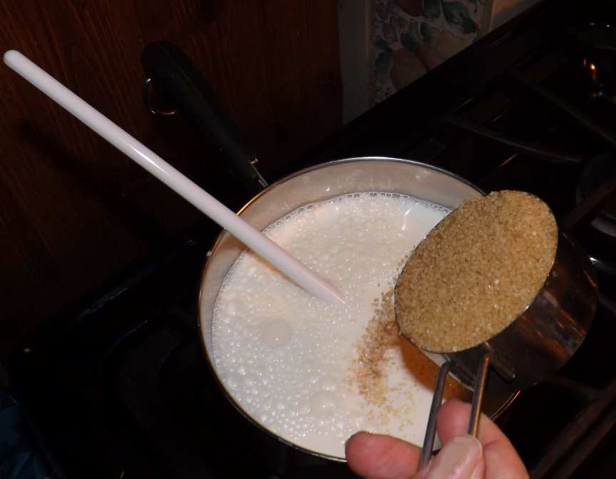 Stir the sugar in as you gently warm the dairy.