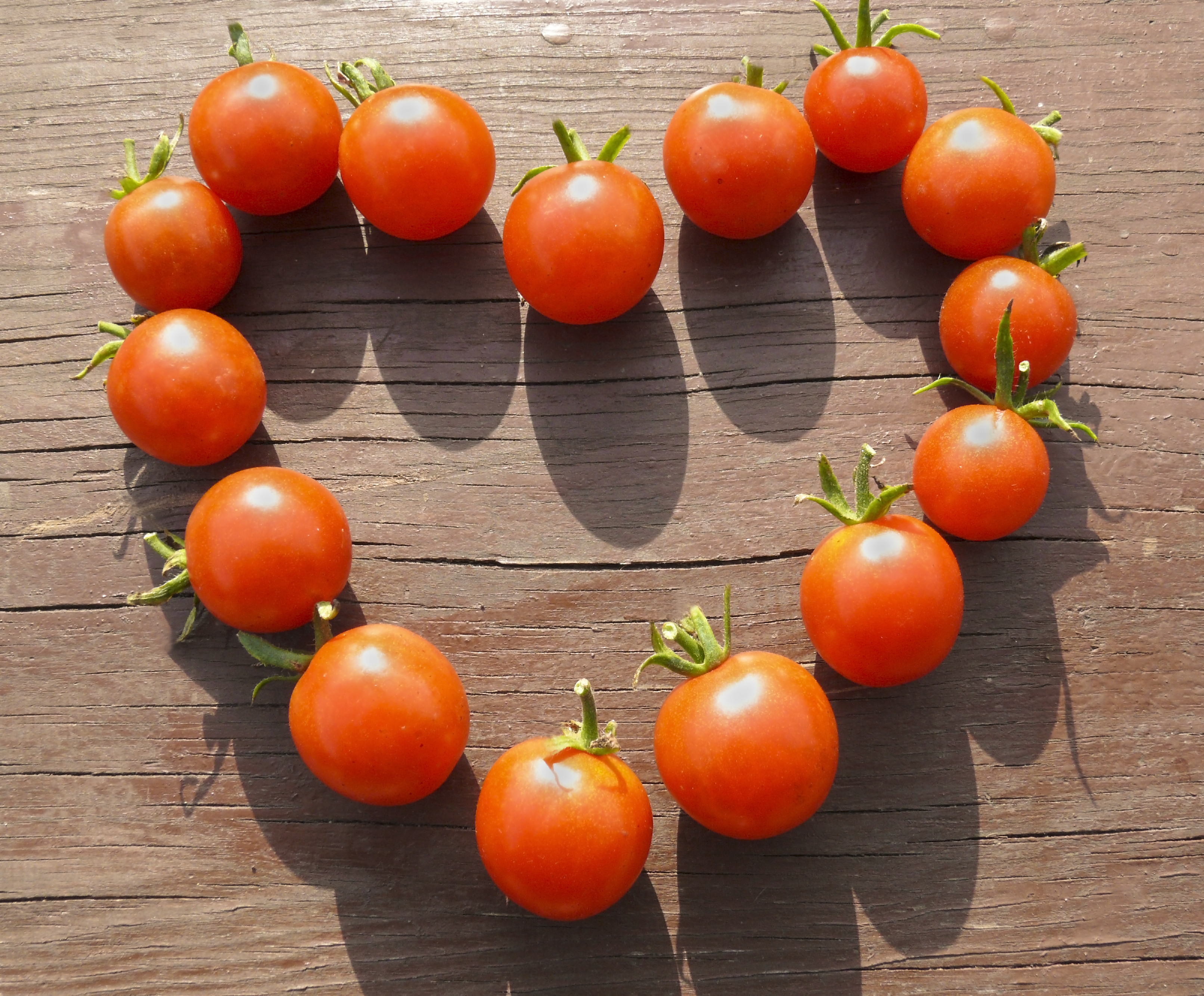 Natural sign of love - heart made from small tomatoes