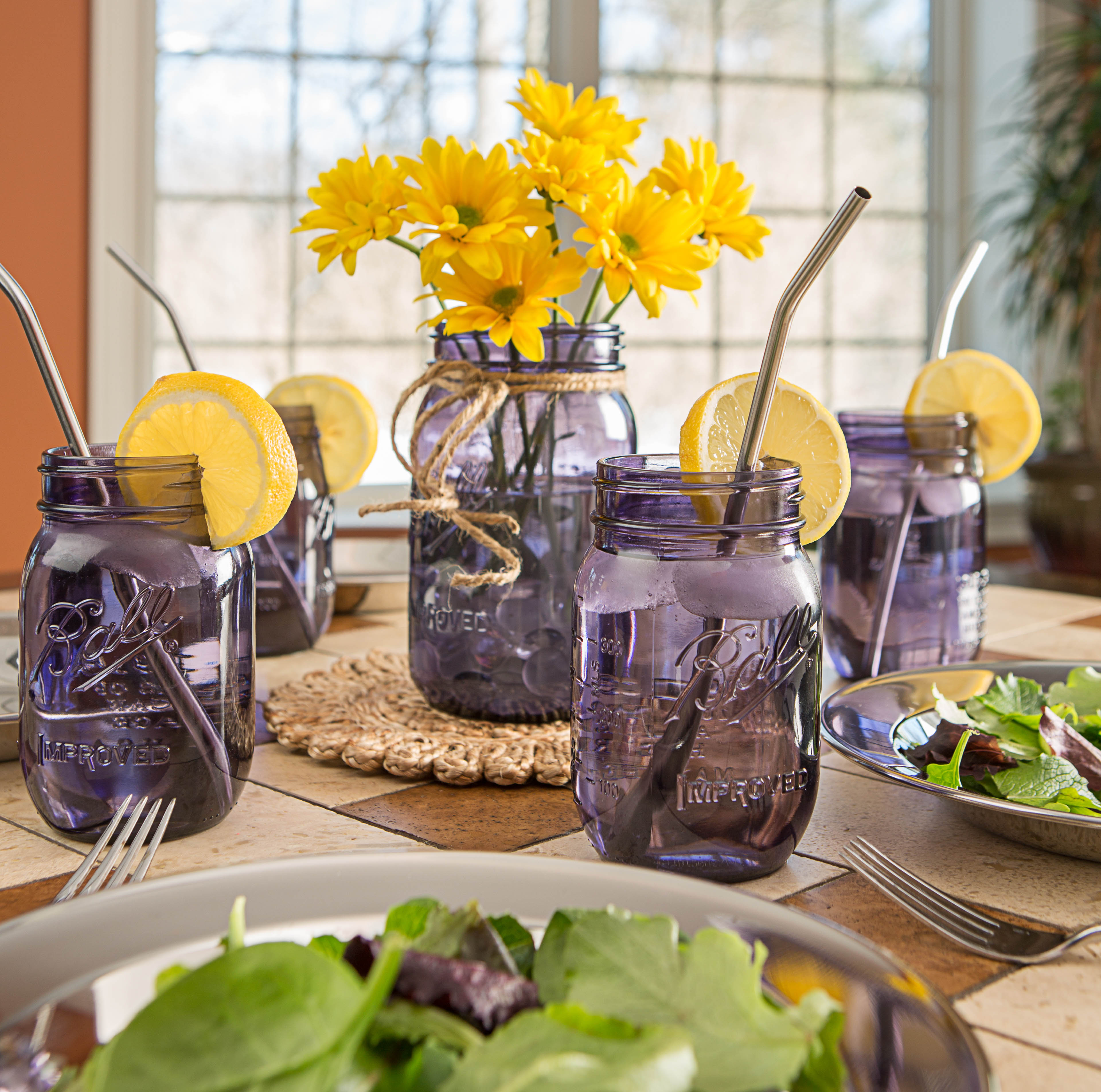 Purple canning jars and classy stainless steel straws give this brunch table a pop of color and style. At Lehmans.com and our store in Kidron, Ohio.