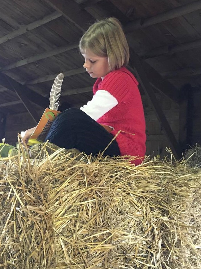school work on bales of hay