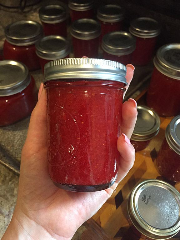 Holding finished strawberry jam