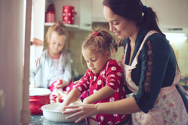 mom and daughters in kitchen