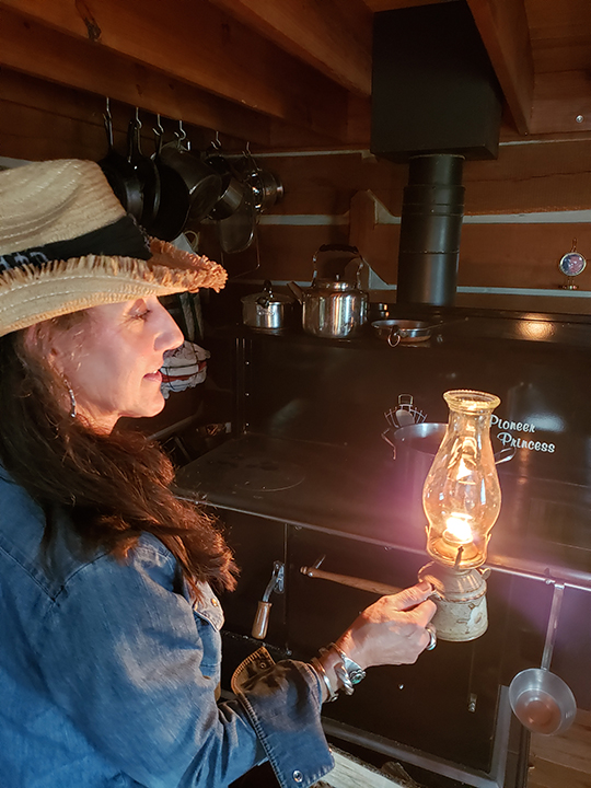 Stacy with oil lamp