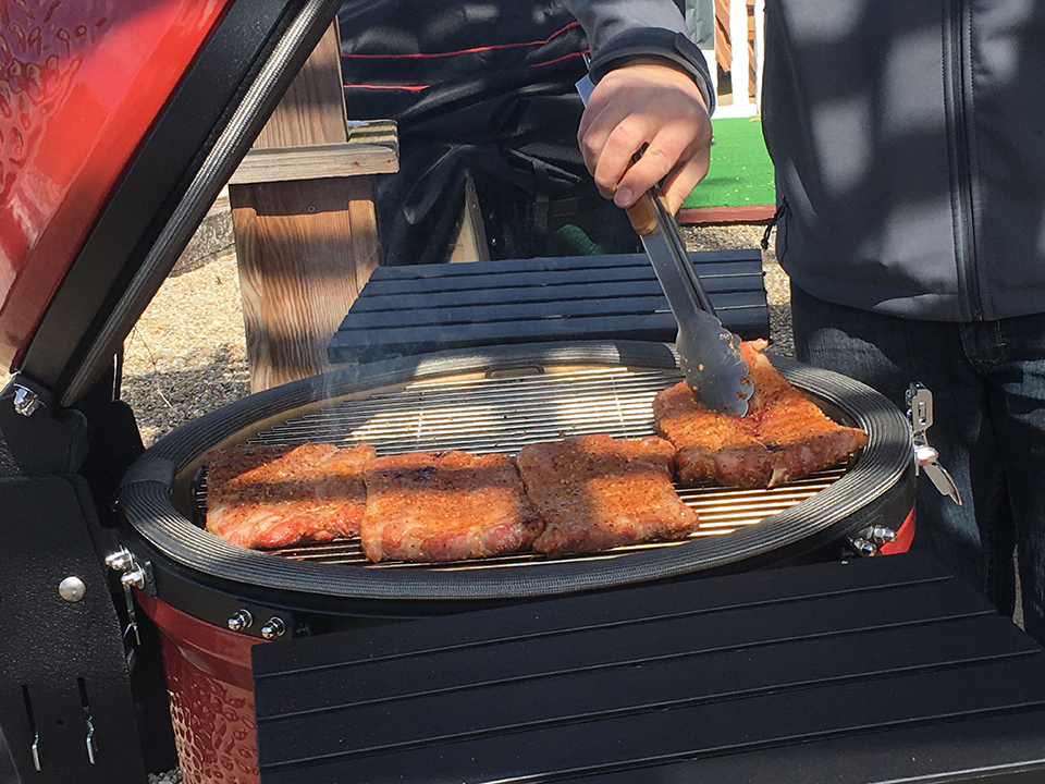 grilling at store with Kamado Joe Grill