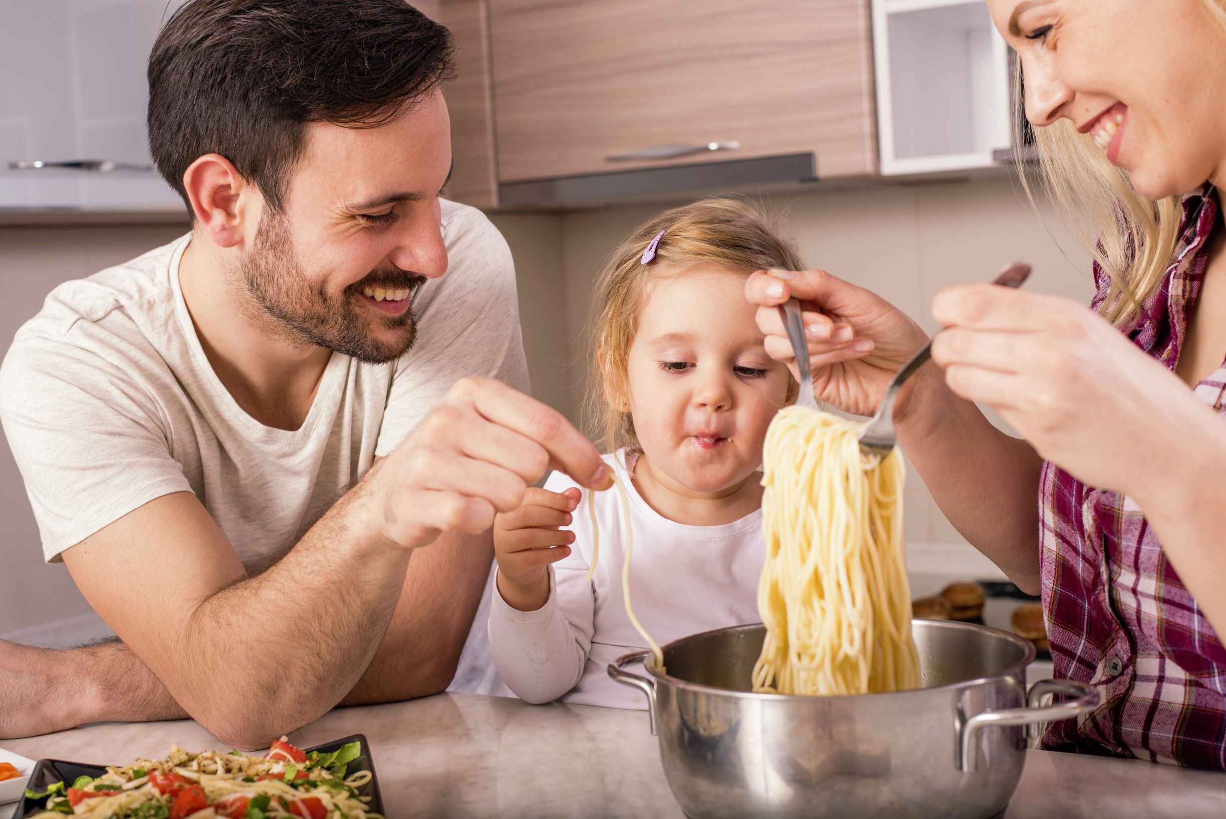 family making spaghetti