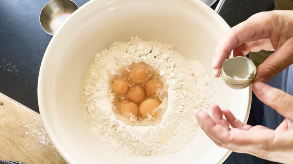 crack eggs in center of flour well