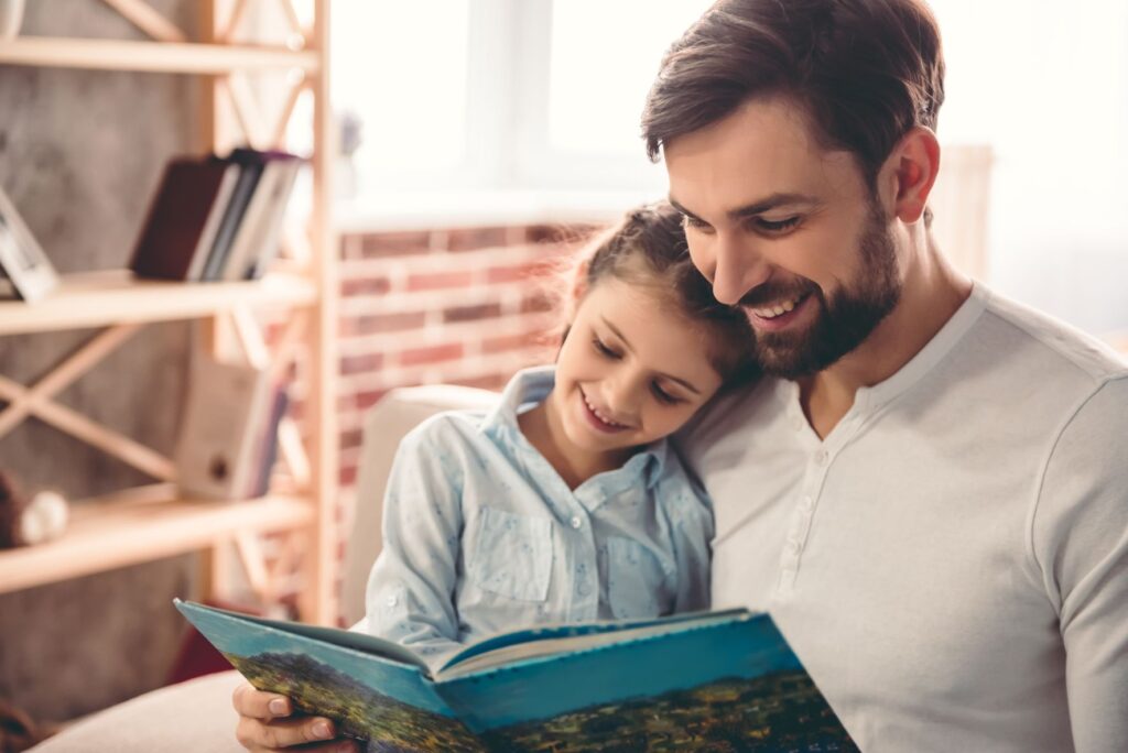 dad reading to daughter