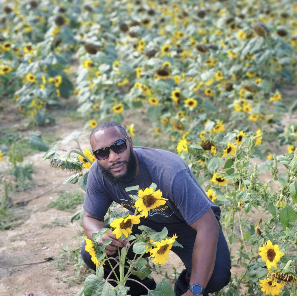 Andrew in a field of sunflowers