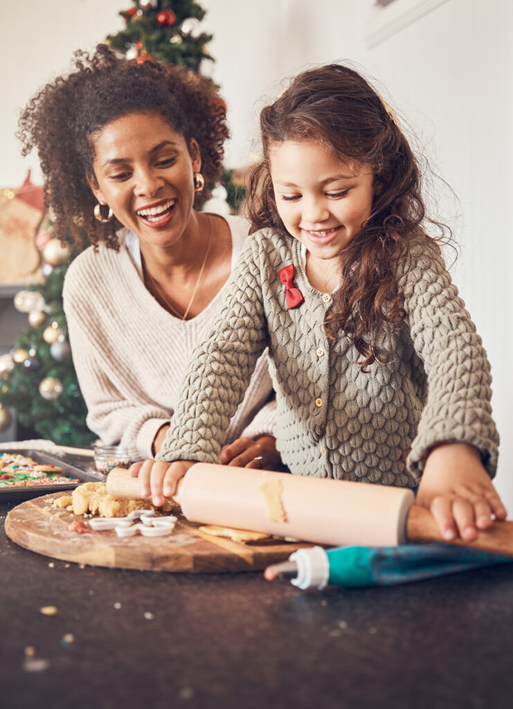 Mother and daughter baking Christmas cookies