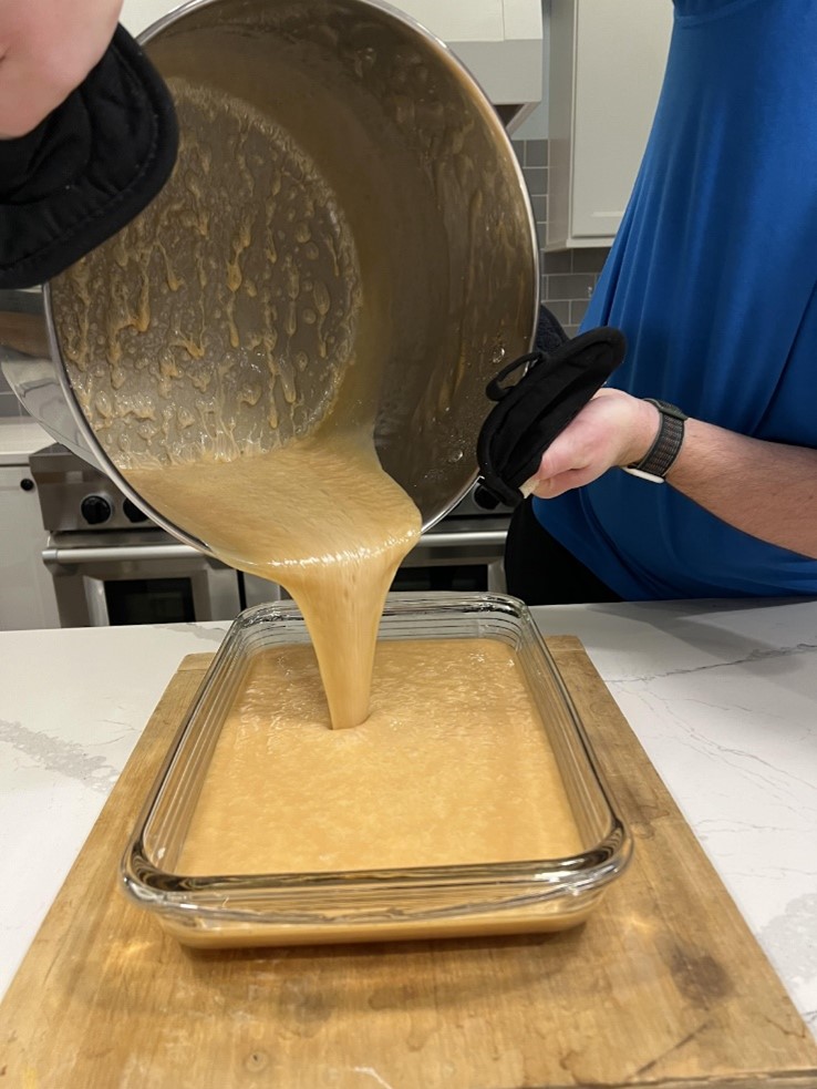 Pouring homemade caramels in a pan