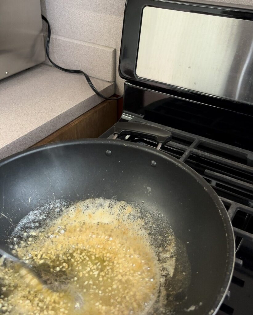 Cooking garlic and butter in saucepan