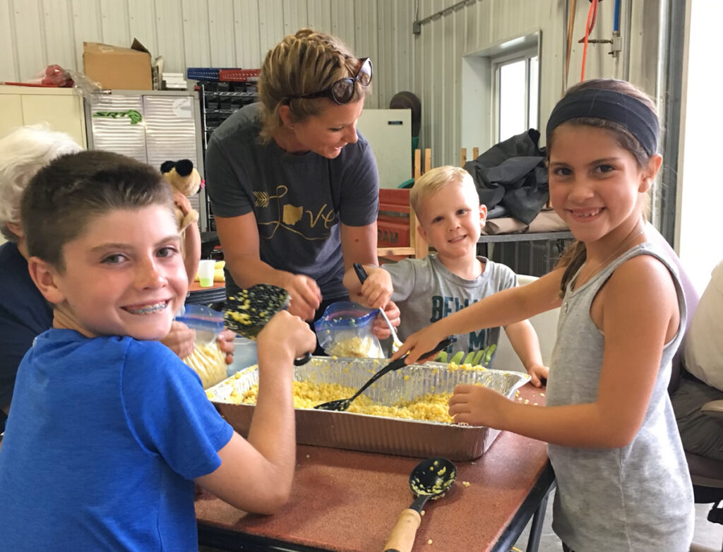 filling freezer bags with sweet corn