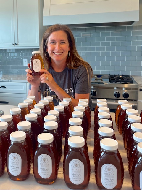 Sarah with honey from her hive