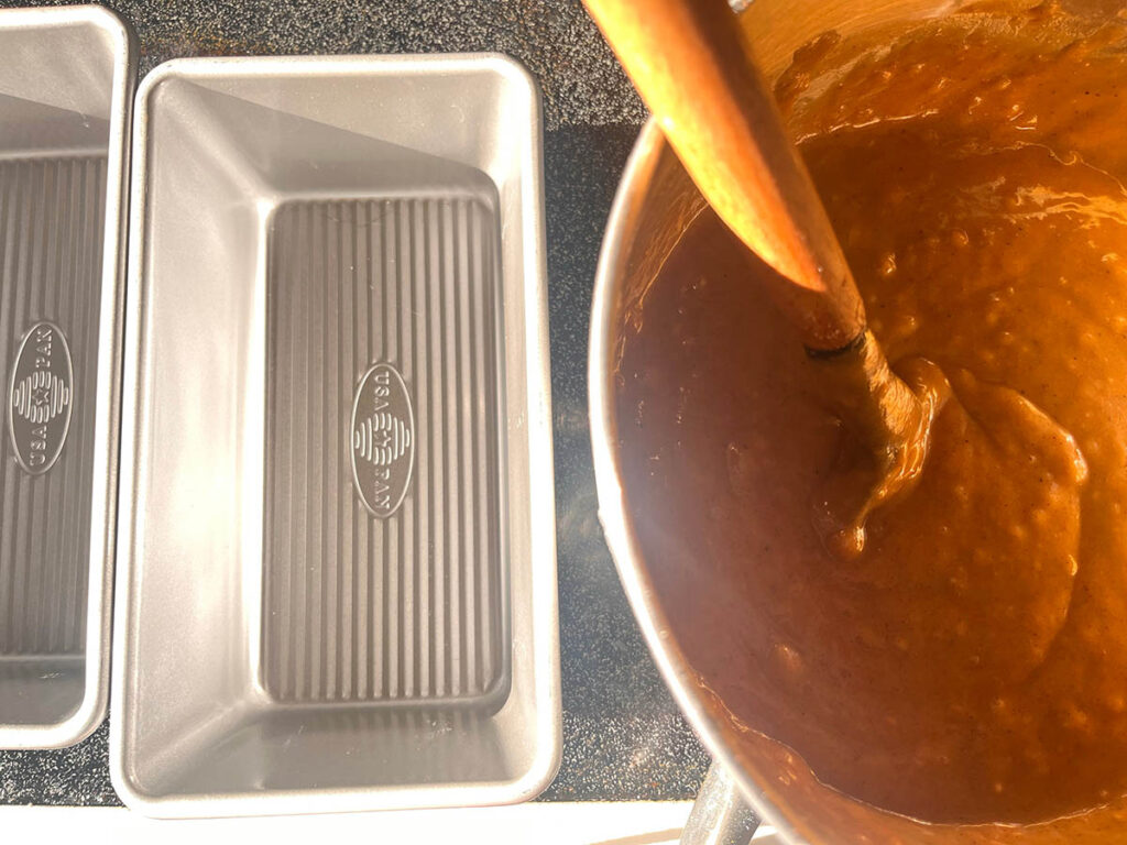 Pumpkin bread ingredients mixed in bowl