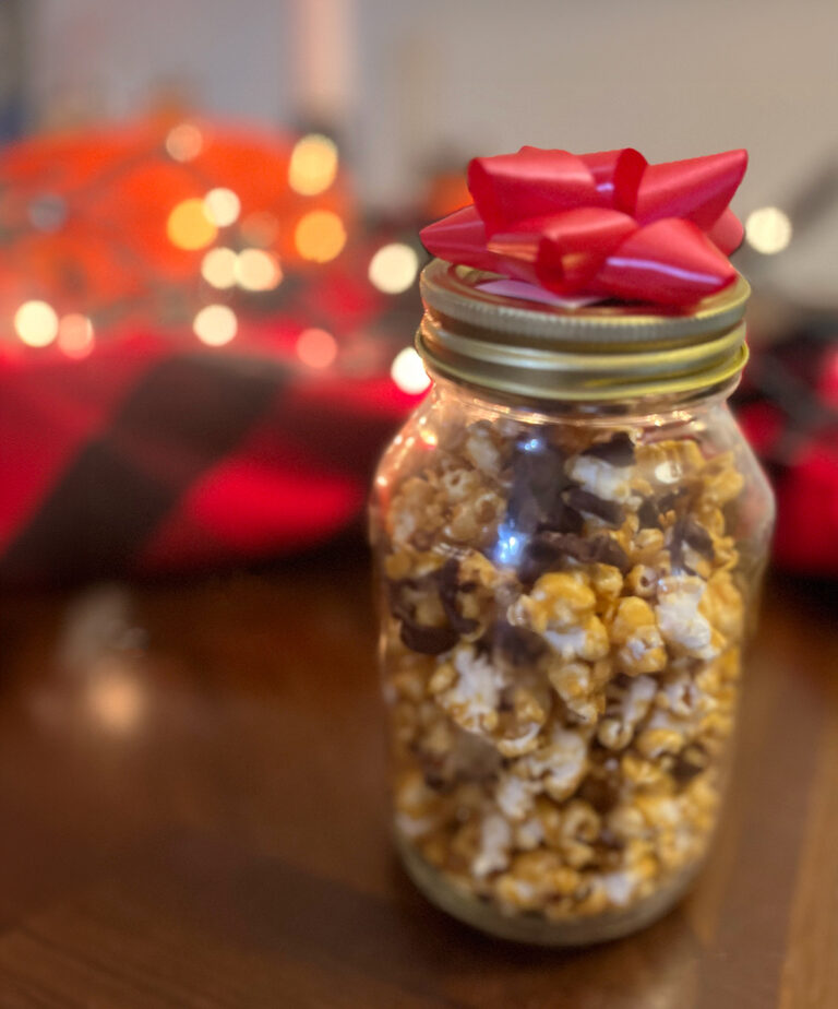 Caramel popcorn with chocolate in mason jar for gifting