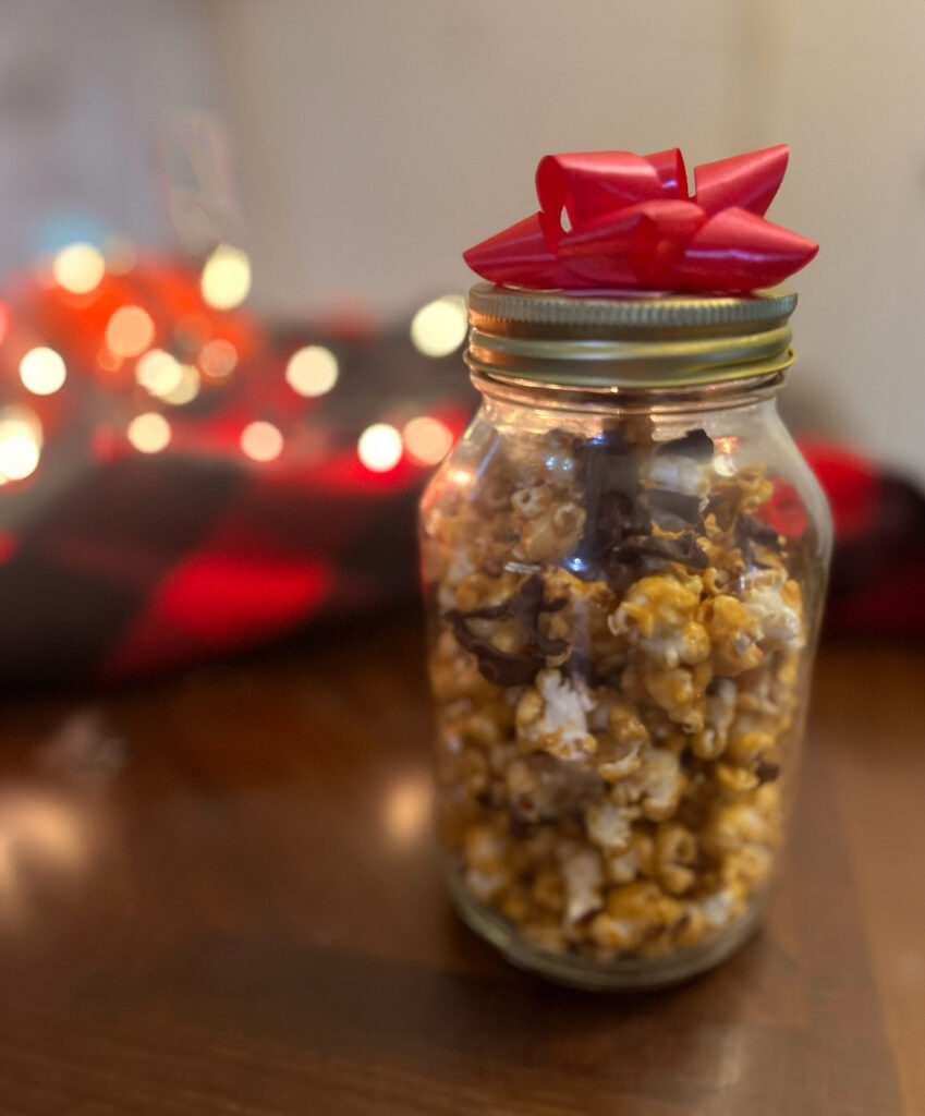 Caramel popcorn in a mason jar for gifting