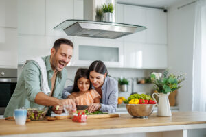 Family cooking together in kitchen