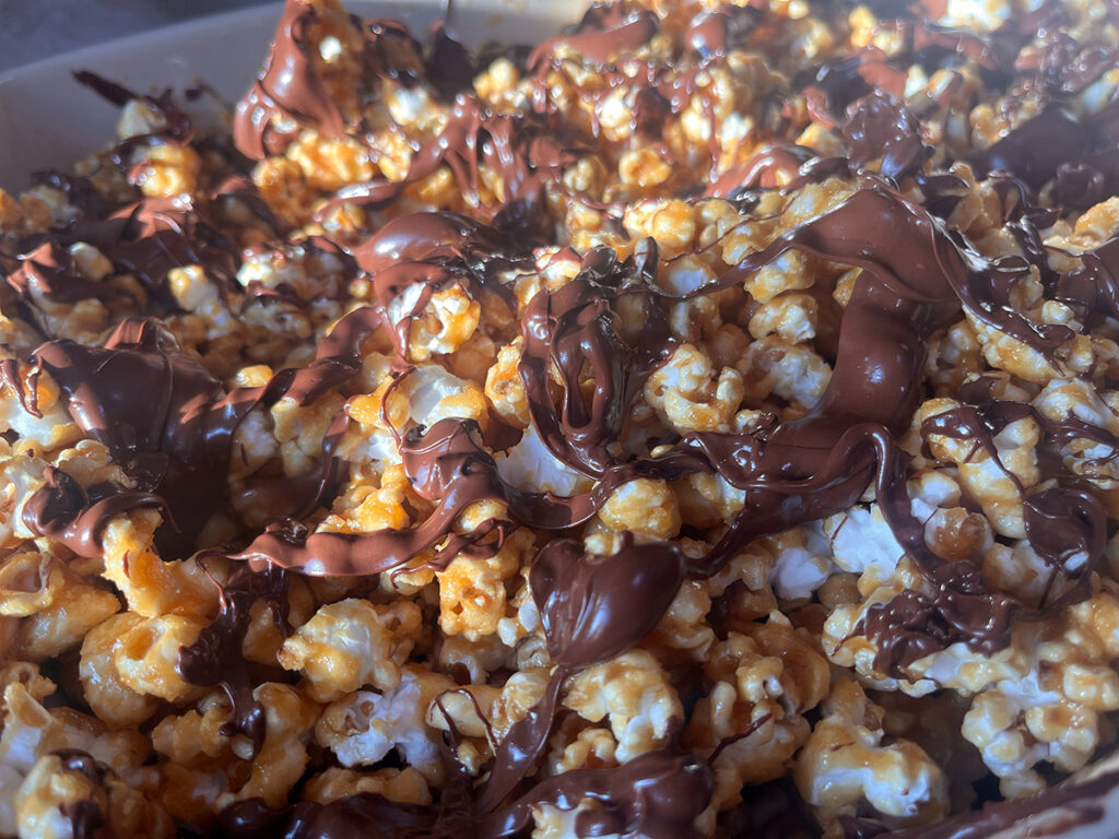 Homemade caramel popcorn drizzled in chocolate