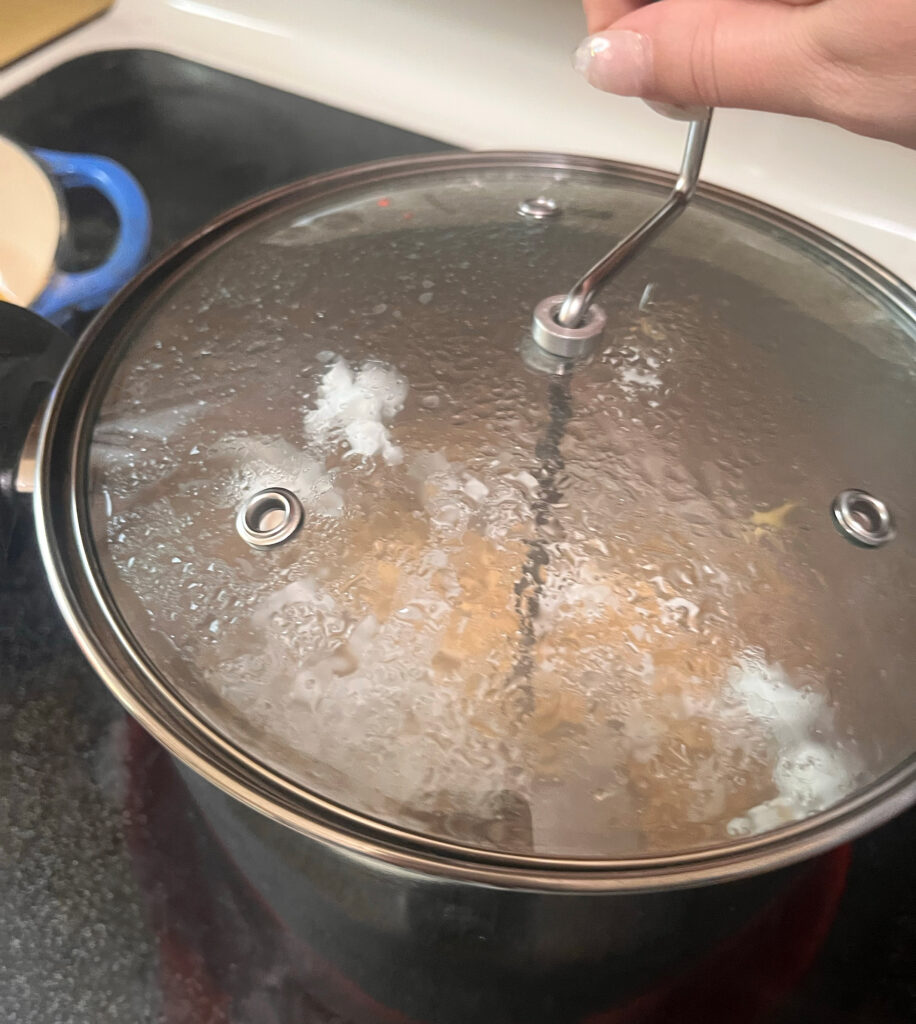 Stirring popped popcorn in Lehman's Popcorn Popper